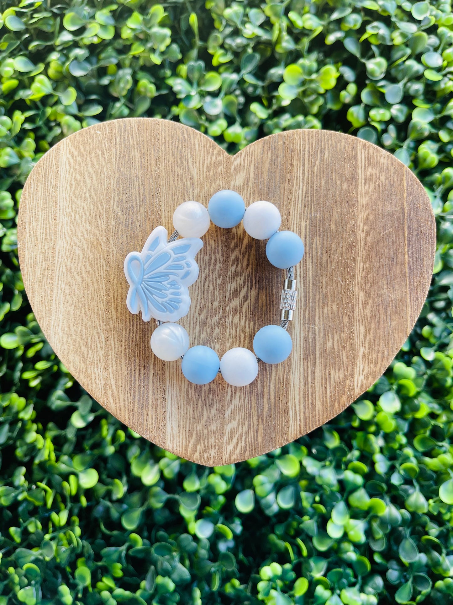 Light blue ribbon handle charm