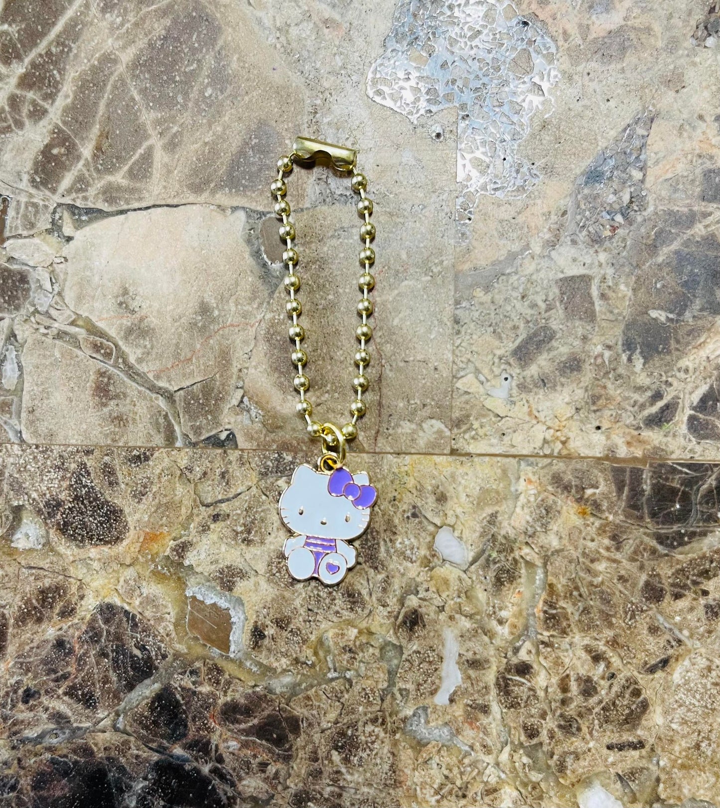 Purple kitty charm