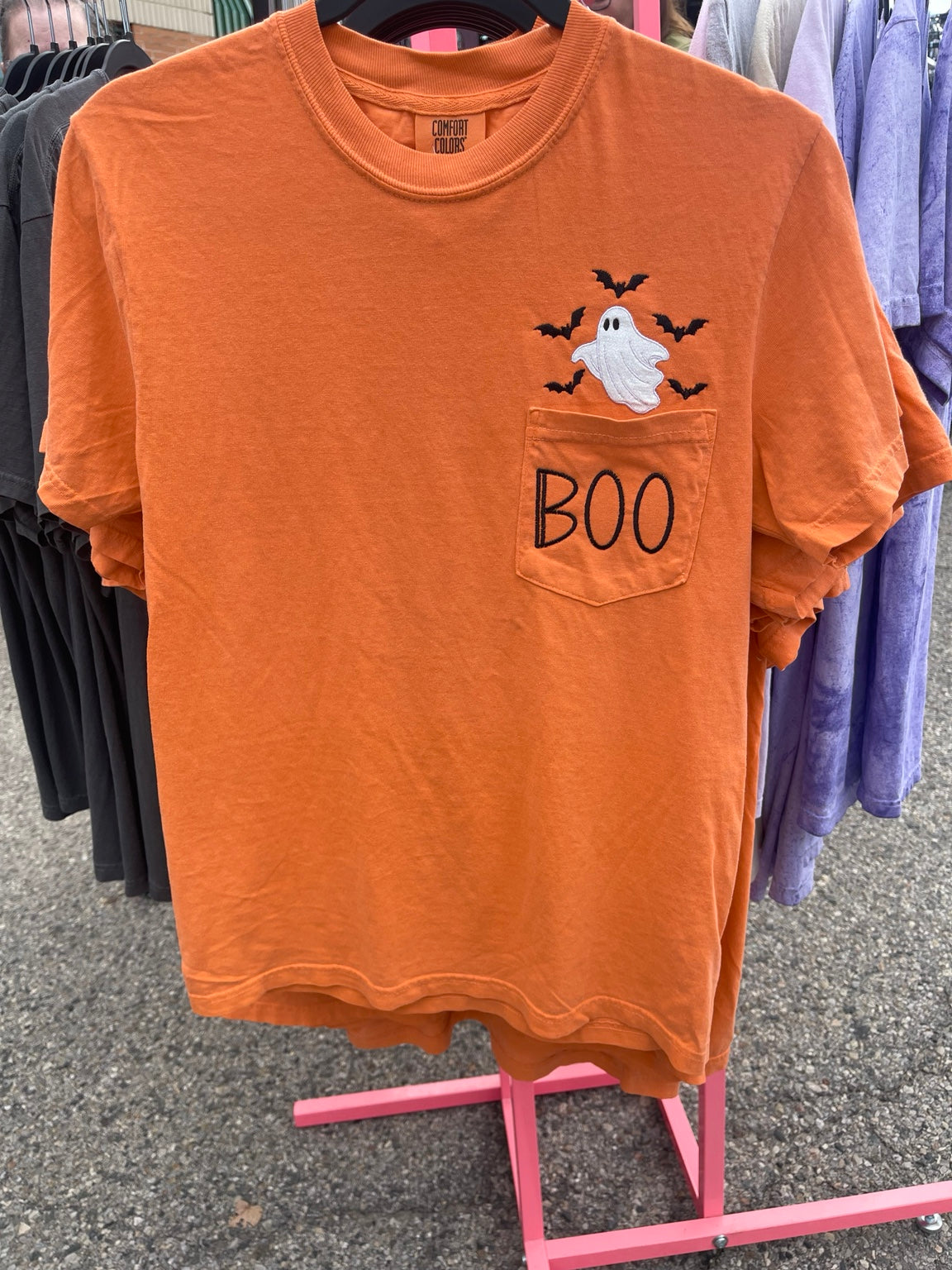 Orange Comfort Colors pocket T-shirt with embroidered ghost, bats, and BOO design