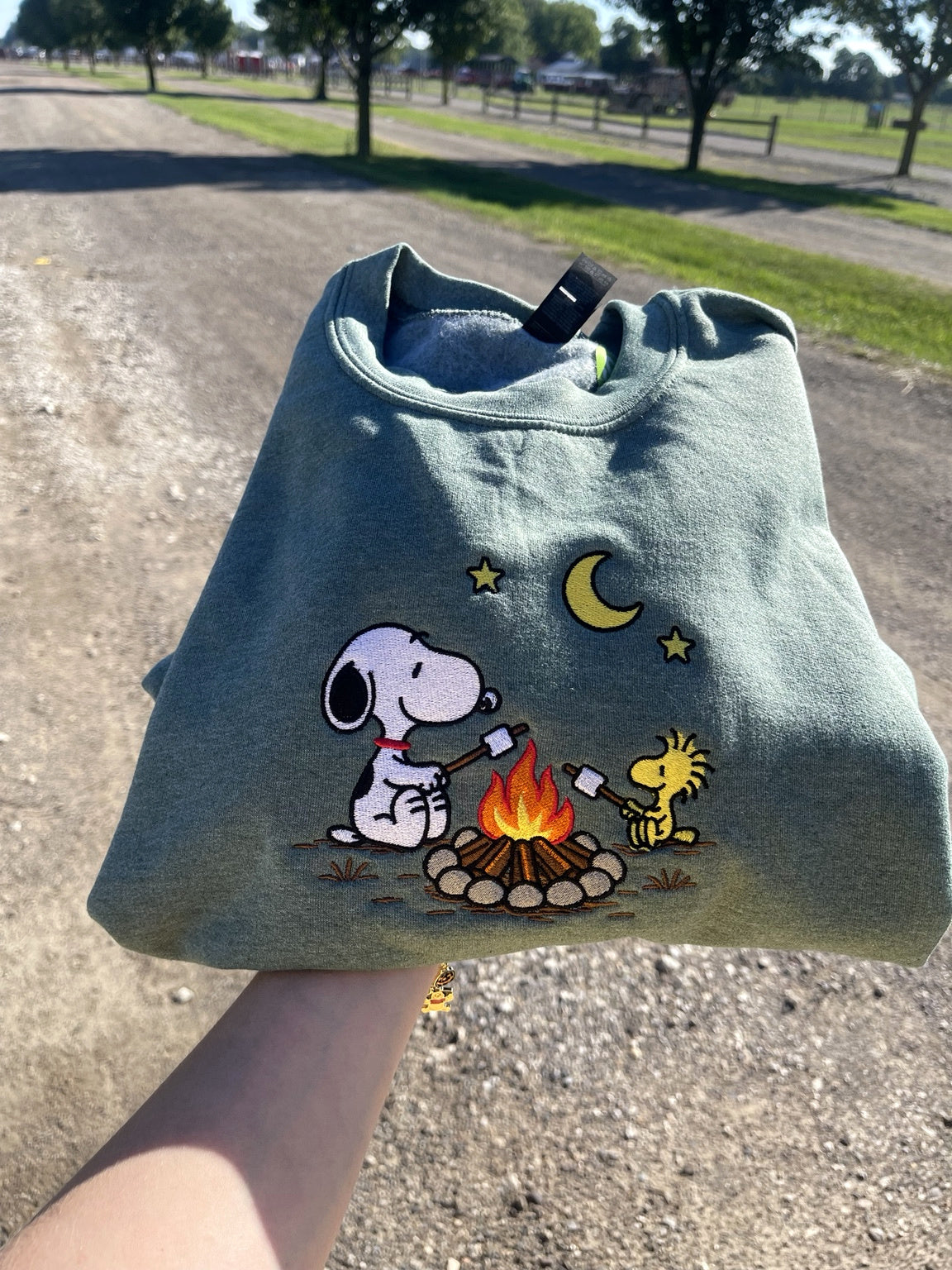Green embroidered campfire dog sweatshirt
