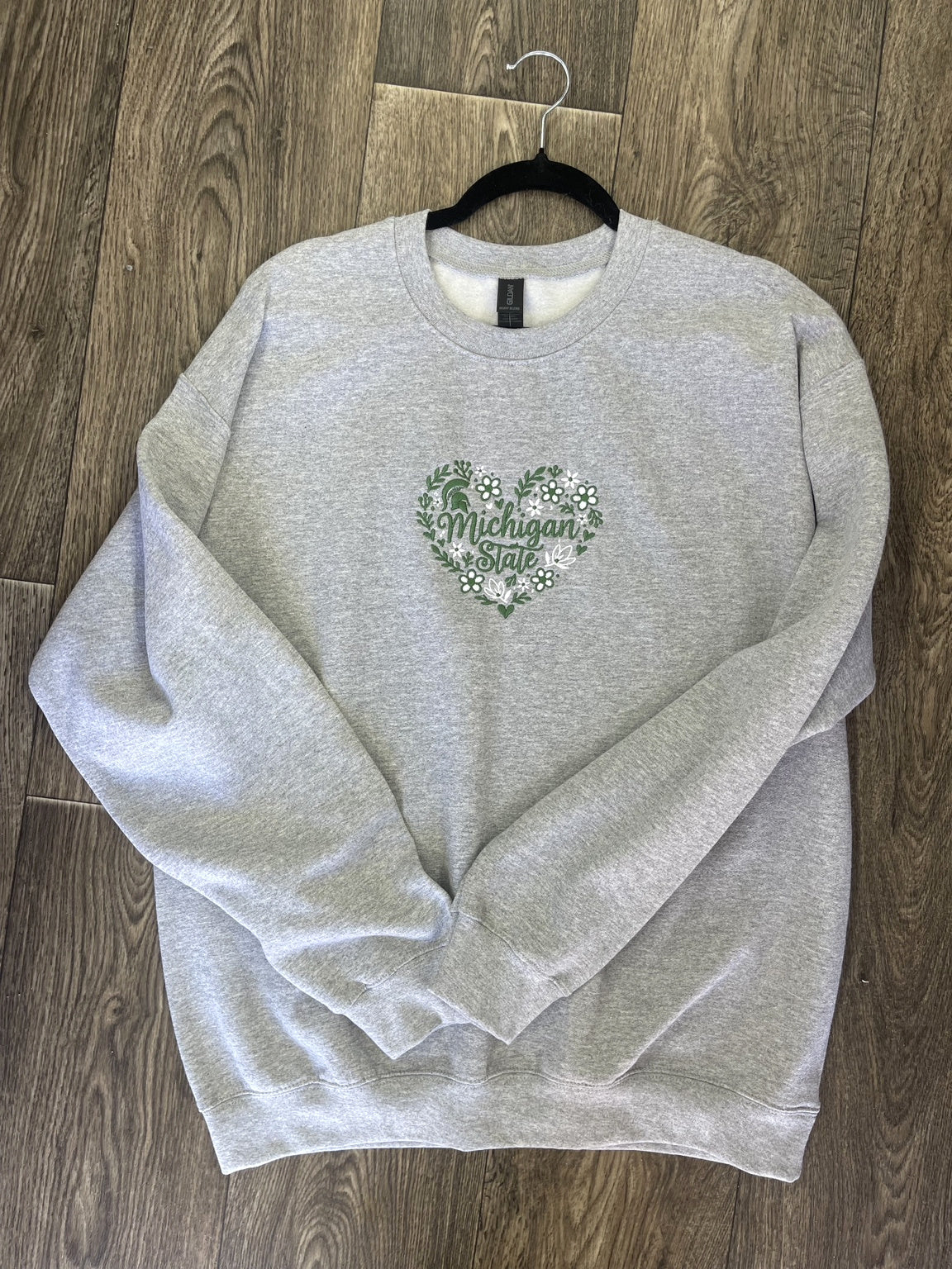 Gray embroidered green floral state pride sweatshirt