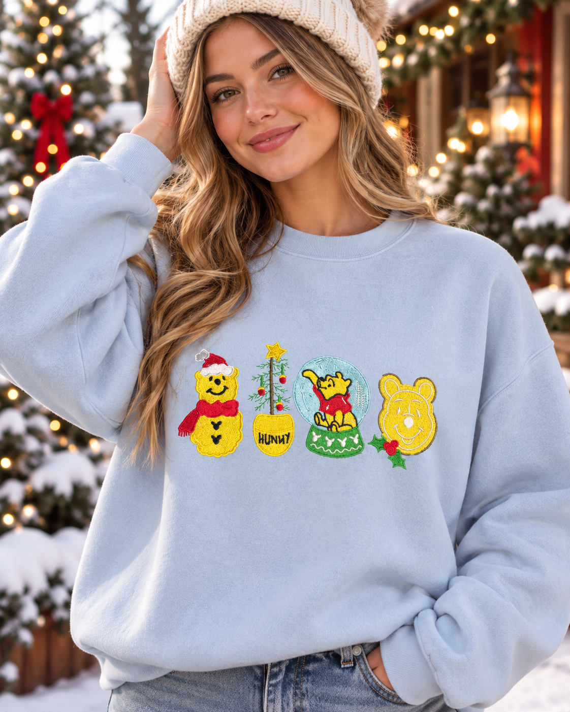 Model wearing light blue Honey Bear Holiday embroidered sweatshirt