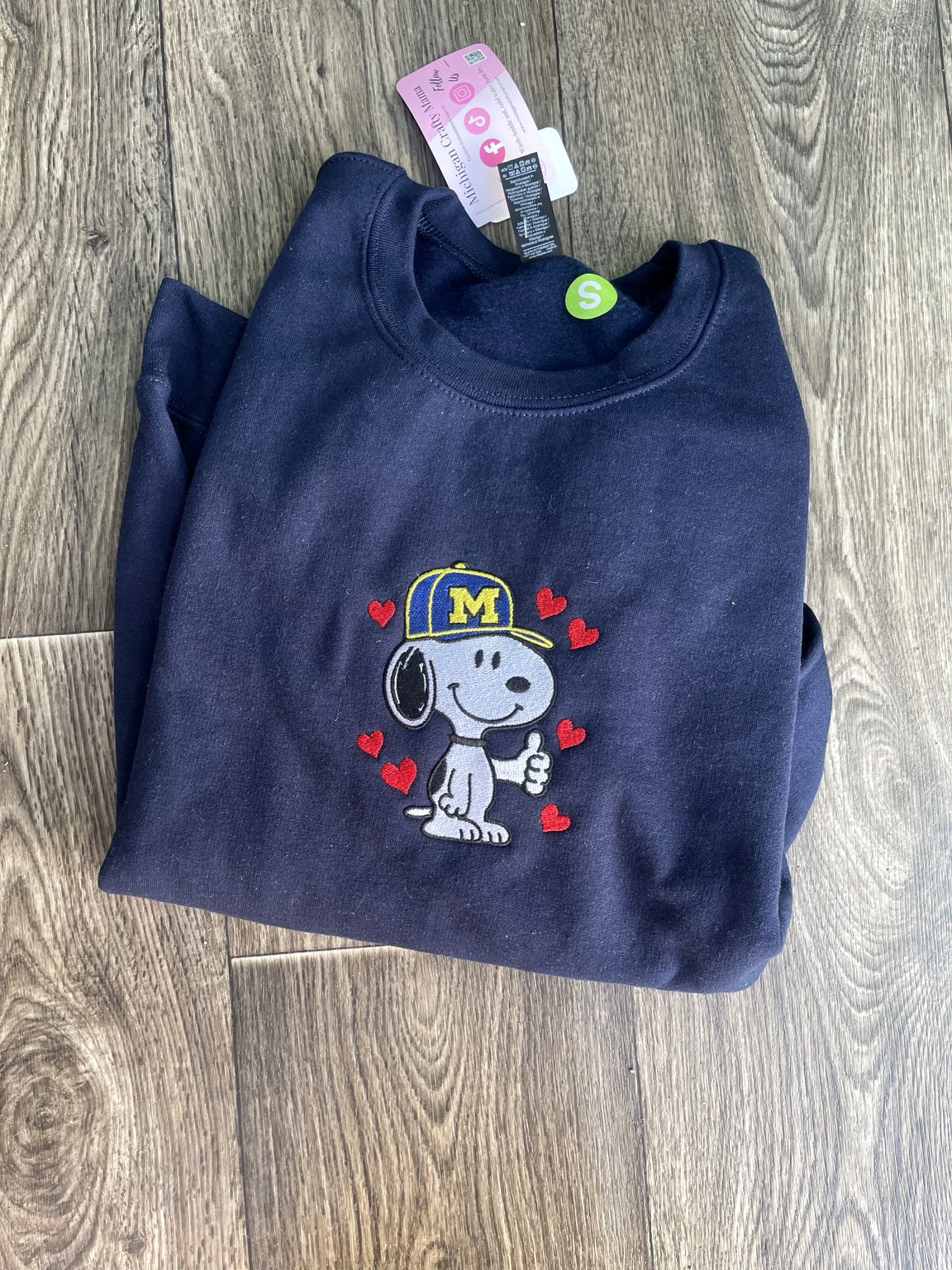 Navy embroidered dog sweatshirt with maize and blue cap