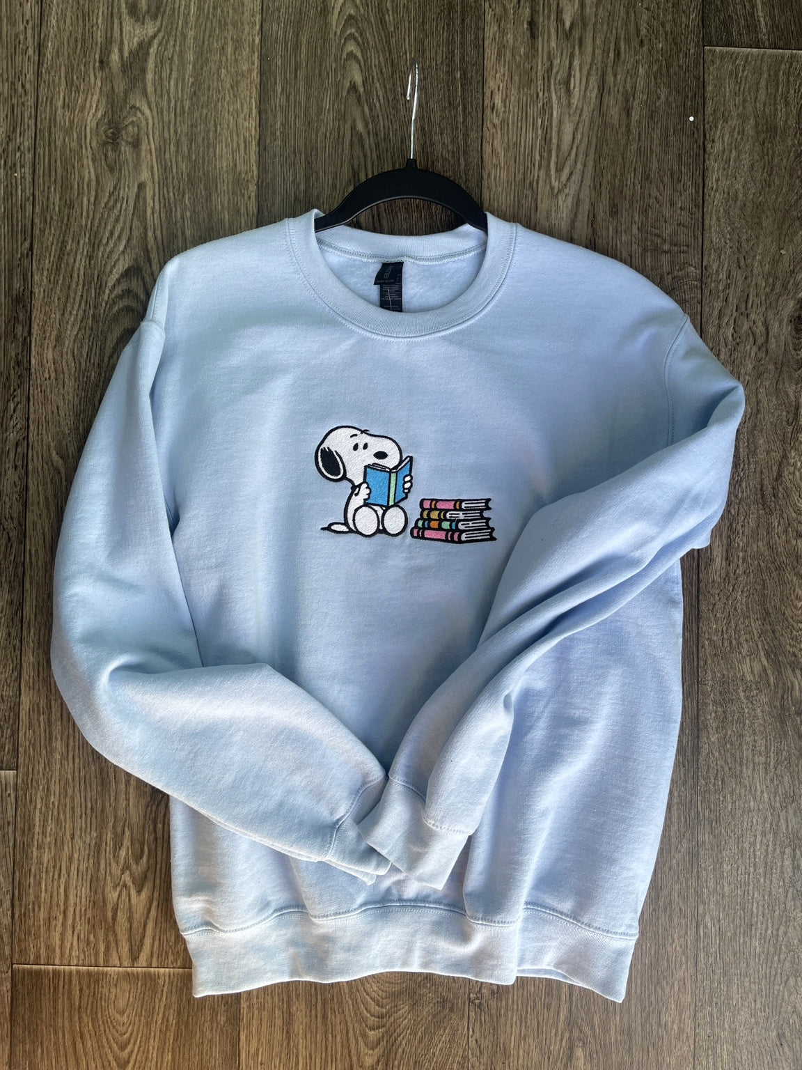 Light blue embroidered reading dog sweatshirt