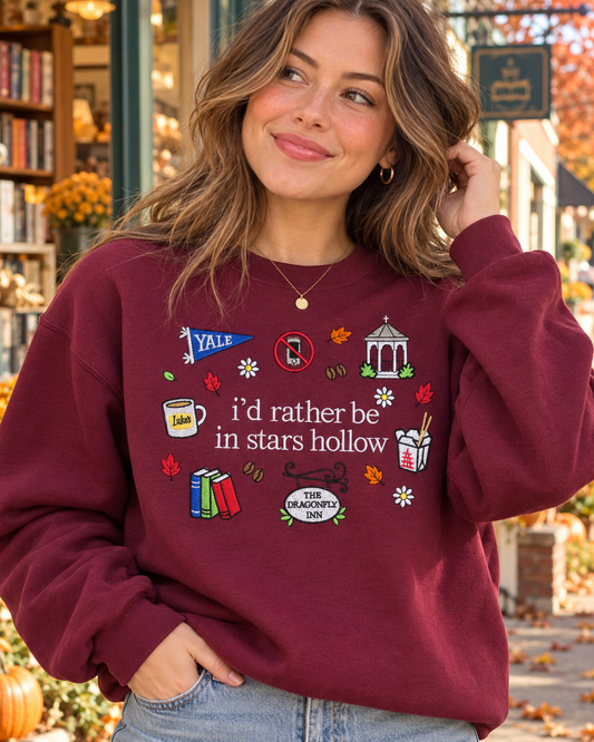 Model wearing burgundy Small Town Fall embroidered sweatshirt