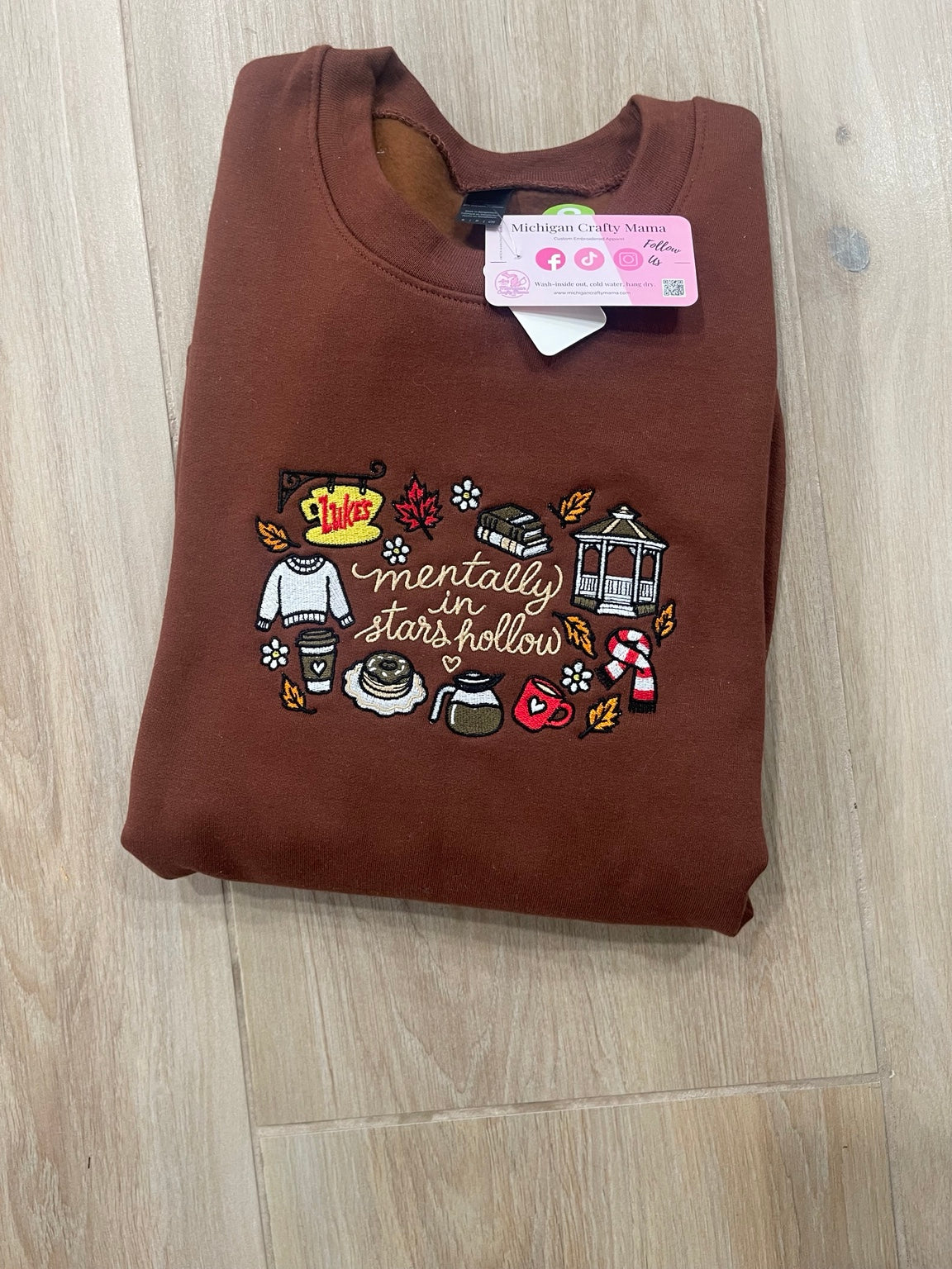 Brown embroidered small town icons sweatshirt